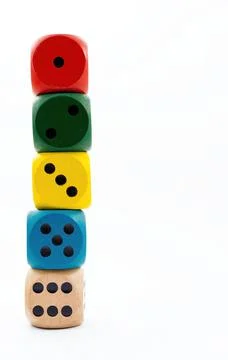 Colored dice on white background. Copy space. Stock Photos