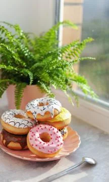 Colored different donuts with icing and topping Stock Photos
