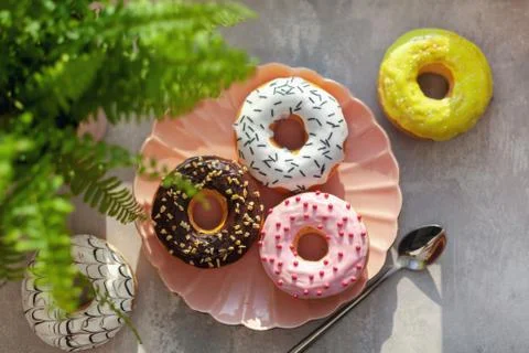 Colored different donuts with icing and topping Stock Photos