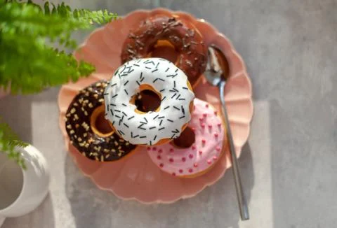 Colored different donuts with icing and topping Stock Photos