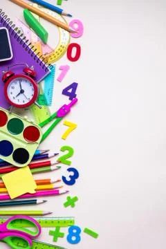 Colored different school supplies on light paper background. Back to school Fotos de archivo