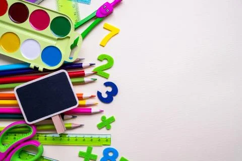 Colored different school supplies on light paper background. Back to school Stock-Fotos