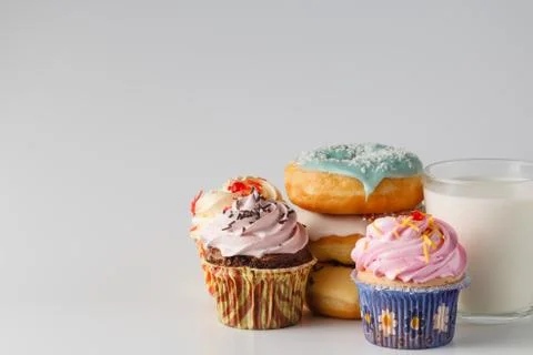 Colored donuts on white plain background Foto stock