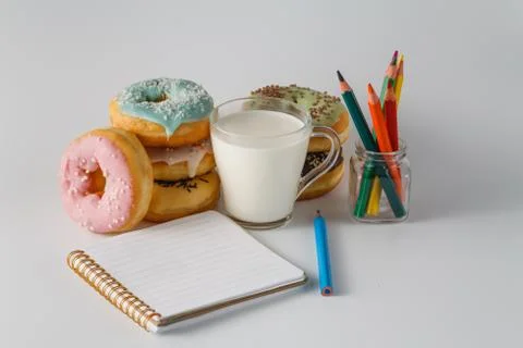 Colored donuts on white plain background Stock Photos