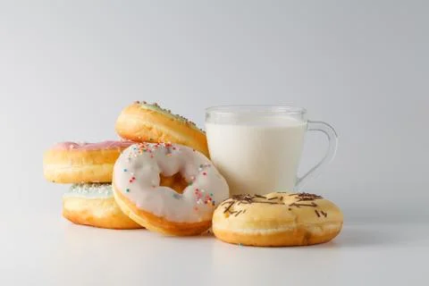 Colored donuts on white plain background Stock-Fotos