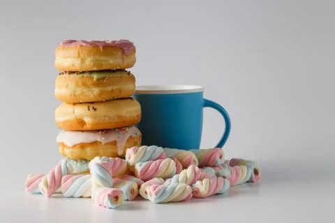 Colored donuts on white plain background Stock Photos