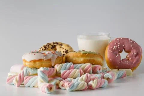 Colored donuts on white plain background Stock Photos