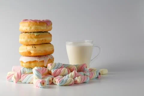 Colored donuts on white plain background Foto stock