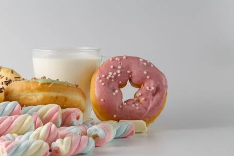 Colored donuts on white plain background Stock Photos