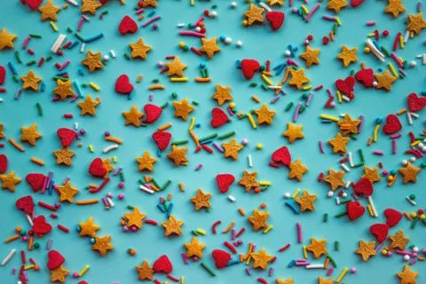 Colored dragee on a blue background. Stock Photos
