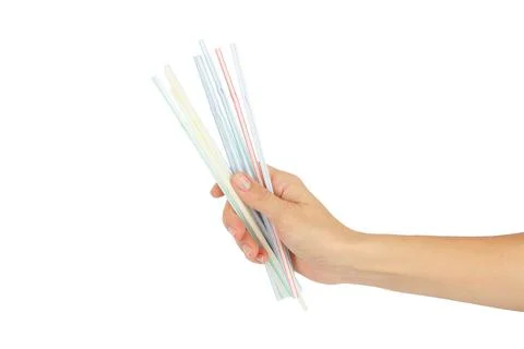 Colored drinking straws in the hand on the white background Stock Photos
