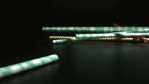 Colored drinking straws for Smoothies, Bubble Tea, Milkshake falling on black Stock Footage 144516380