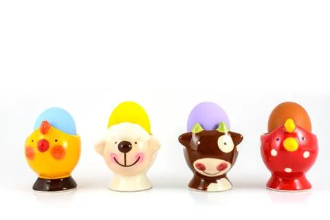 Colored easter egg in fancy cup Foto stock