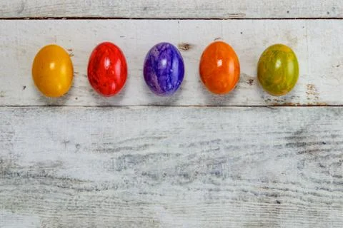 Colored easter egg on wood background Stock Photos