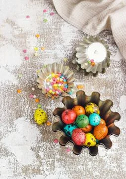 Colored easter eggs and baking molds on a light canvas background,place for t Stock Photos