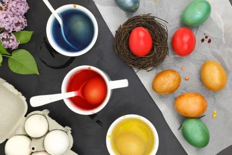 Colored Easter eggs and liquid color dyes Stock Photos