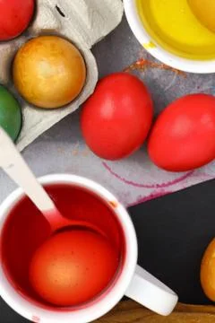 Colored Easter eggs and liquid color dyes Stock Photos