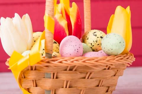 Colored Easter eggs in the basket Stock Photos