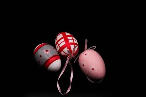 Colored easter eggs on black background Photos