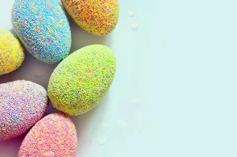 Colored easter eggs on a blue background. Holiday concept. Stock Photos