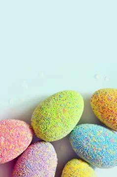 Colored easter eggs on a blue background. Holiday concept. Stock Photos