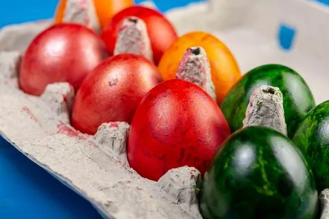 Colored Easter Eggs in cardboard box Stock Photos