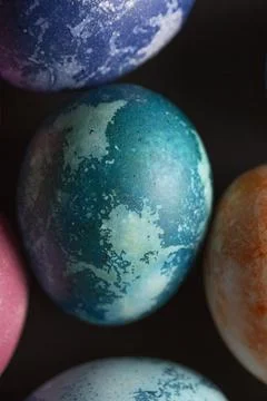 Colored Easter eggs on a dark background. Stock-Fotos