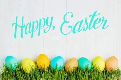 Colored Easter eggs on the grass Stock Photos