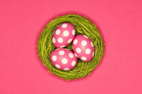 Colored easter eggs in a green nest Foto stock