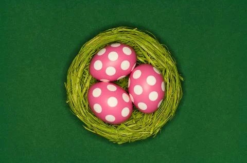 Colored easter eggs in a green nest Foto stock