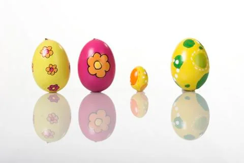 Colored easter eggs isolated on white with reflection Stock Photos