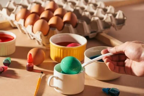 Colored easter eggs on a light canvas background,place for text. Stock Photos