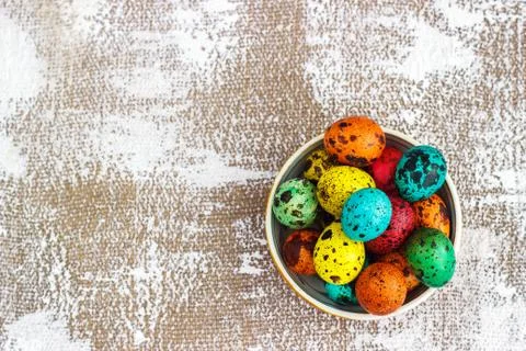 Colored easter eggs on a light canvas background,place for text Stock Photos