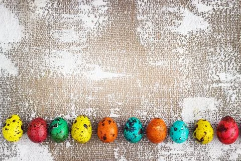 Colored easter eggs on a light canvas background,place for text Stock Photos