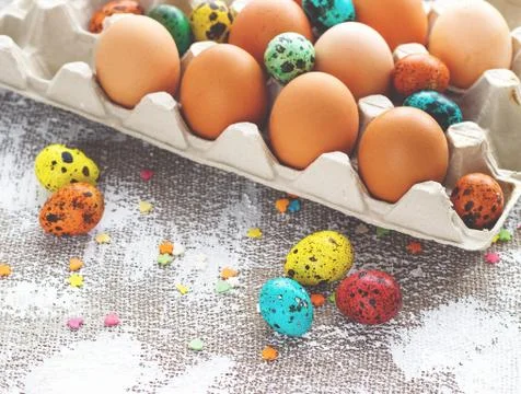Colored easter eggs on a light canvas background,place for text Stock Photos