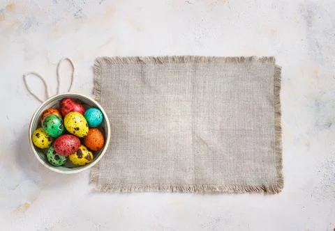 Colored easter eggs on a light canvas background,place for text Stock Photos
