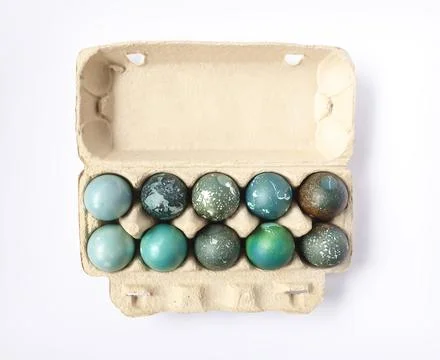 Colored Easter eggs in the paper box. Stock Photos