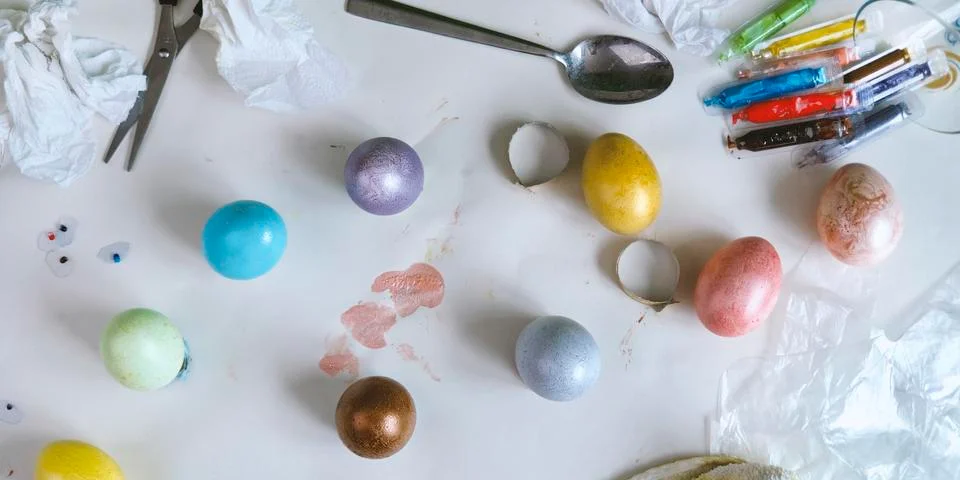 Colored easter eggs on paper gray background 스톡 사진