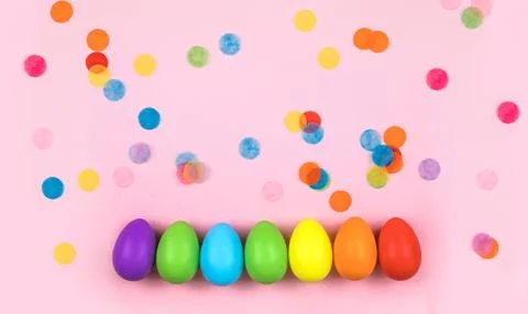 Colored Easter eggs on pink background. Flatlay. Stock Photos