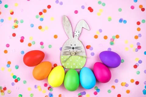Colored Easter eggs on pink background. Flatlay. Stock Photos