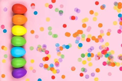 Colored Easter eggs on pink background. Flatlay. Stock Photos