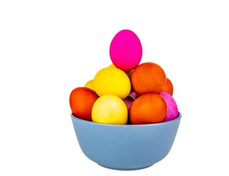 Colored Easter eggs in a plate on a white background. Stock Photos