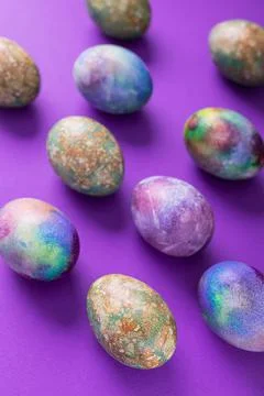 Colored easter eggs on a violet trend Stock Photos