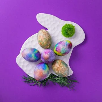 Colored easter eggs on a violet trend Stock Photos