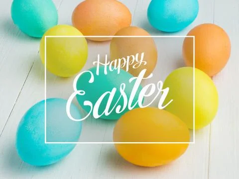 Colored Easter eggs on a white table Stock Photos