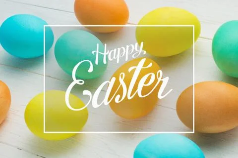 Colored Easter eggs on a white table Stock Photos