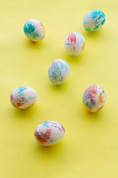 Colored easter eggs on a yellow background Stock Photos