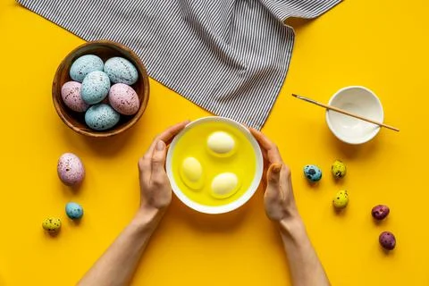 Colored Easter eggs with yellow dye. Top view 스톡 사진