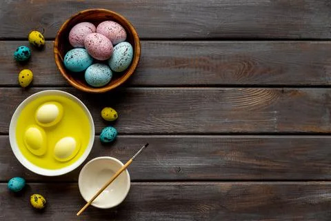 Colored Easter eggs with yellow dye. Top view Stock Photos