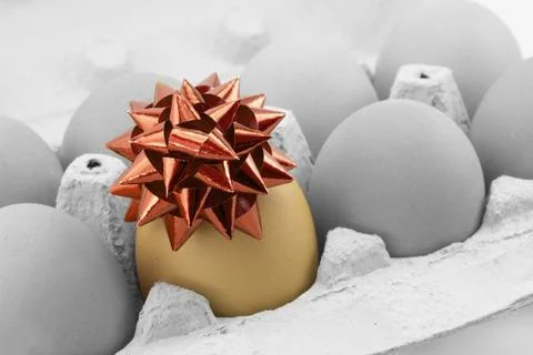 Colored egg with bow Stock Photos